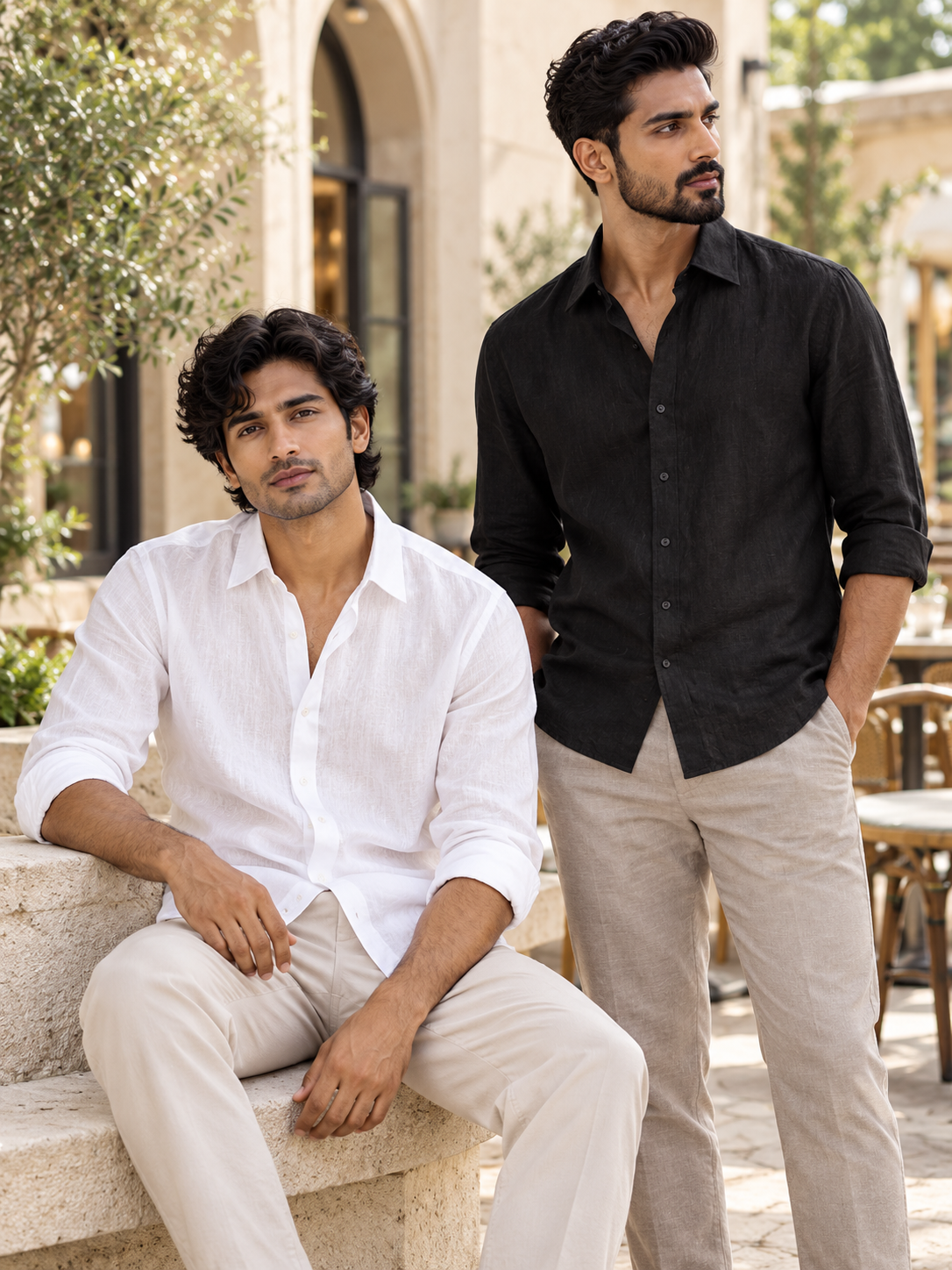 Aura Duo Combo – Black and White Lifestyle Two Indian male models in black and white linen shirts at an outdoor cafe