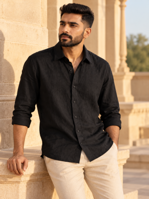 Indian male model posing outdoors in a black linen shirt