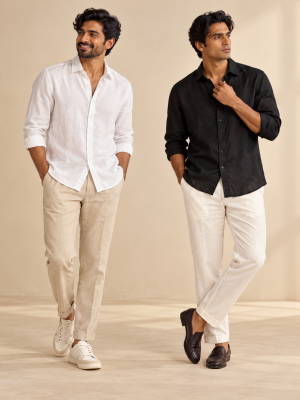 Two Indian male models showing black and white linen shirt colour options